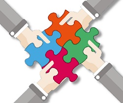 4 piezas de puzzle entrelazadas sujetas por 4 manos, respectivamente.