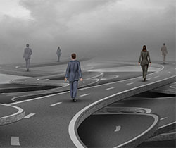 Imagen de un autopista con curvas entrelazadas con varias personas sobre ella