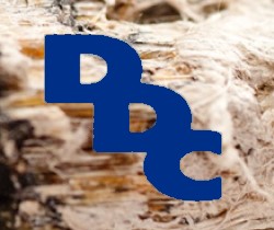 Siglas DDC e imagen de una radiografía sobre foto de fibras de amianto